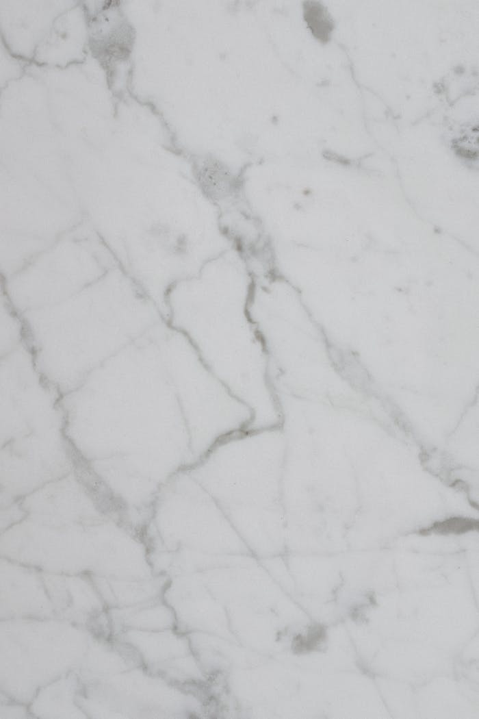 mobile-02 Smooth white marble texture ideal for backgrounds and designs.